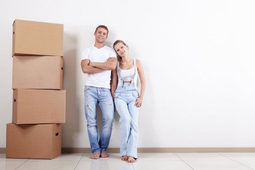 Professional piano removals team handling an upright piano in Croydon